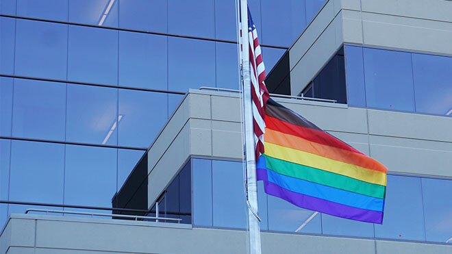 Pride flag in front of a building