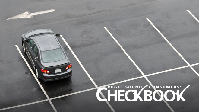 Aerial photo of a black sedan, the only car in a parking lot with eight spaces visible. Consumers' Checkbook logo in lower right.