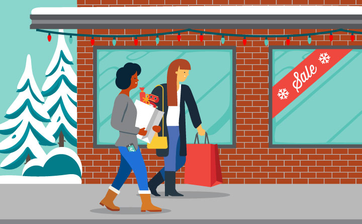 This is an illustration of two women shopping outside. They are walking past a brick building that has a "sale" sign on it. They have shopping bags in their hands. There are two snowy trees in the distance. The building has holiday lights strung across the top of the building.