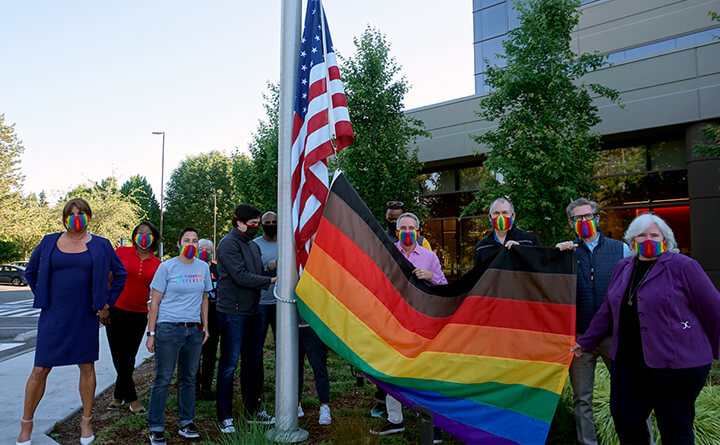 Pride flag in front of a building